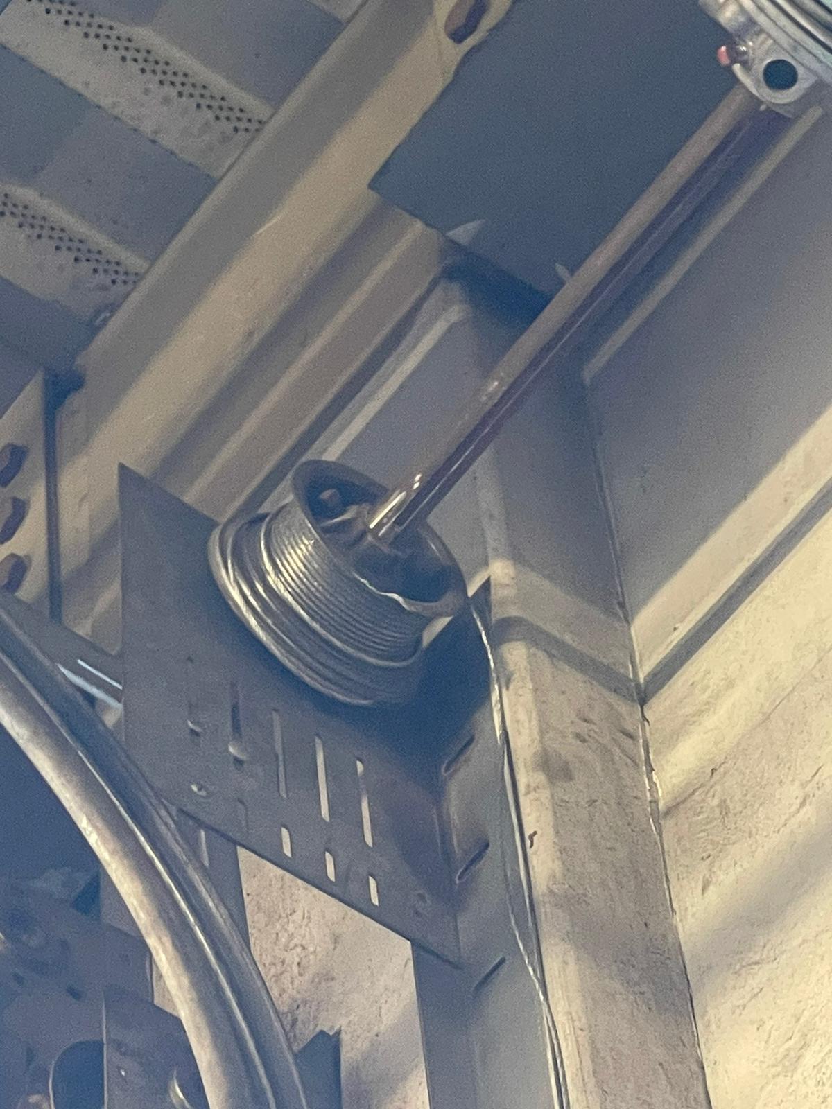 Broken commercial garage door drum system