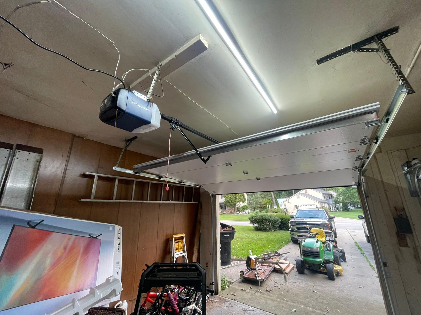 Interior view of newly installed garage door and opener system