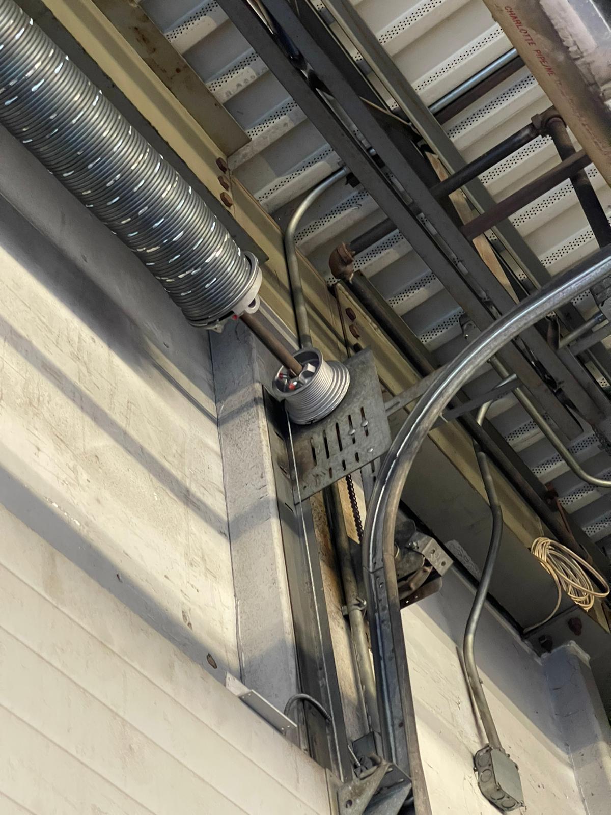 New commercial garage door drum installation