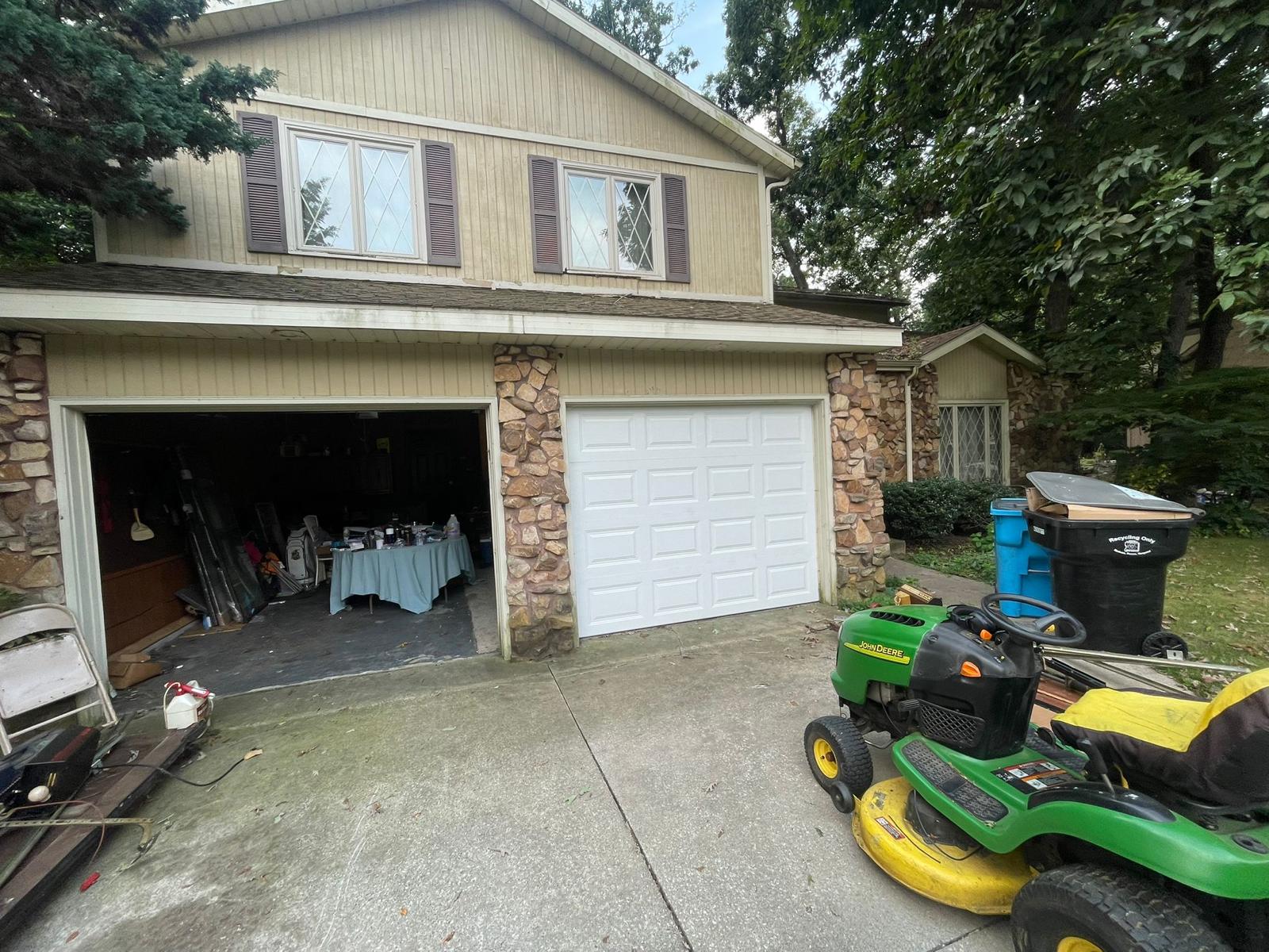 Wide exterior view of newly installed garage door on residential home